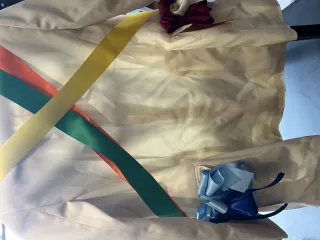 Close-up of a ribbon-decorated blazer, styling detail