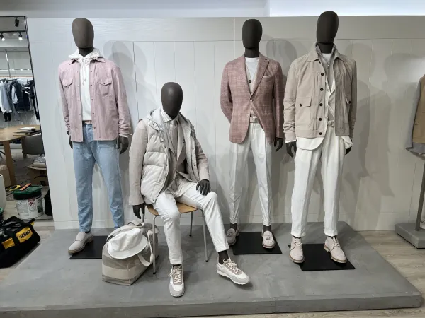 Menswear styled on mannequins in the Eleventy Milano showroom